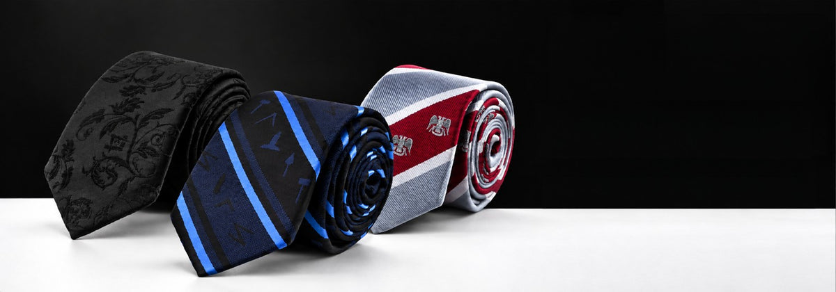Three Masonic Revival ties in black blue and red
